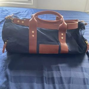 Navy duffel bag leather straps